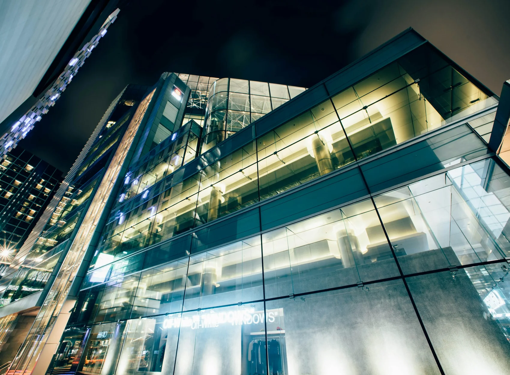 Glass office architecture illuminated at night