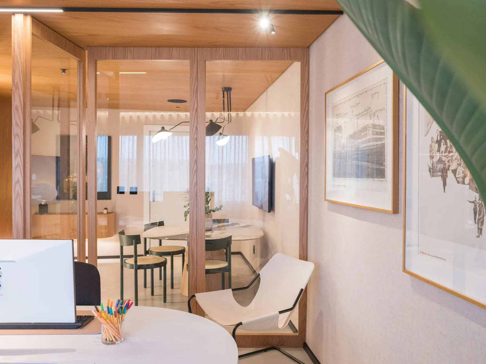 Modern workspace with warm wood and glass